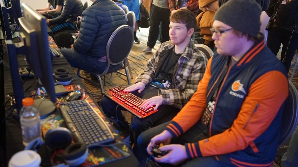 Competitive gamers playing esports with controllers and keyboards, representing teen and adult gaming experiences