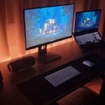 Modern dual-screen gaming setup for cross-platform survival games. Photo by Unsplash contributor.