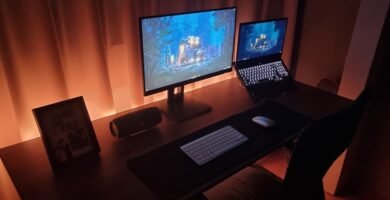 Modern dual-screen gaming setup for cross-platform survival games. Photo by Unsplash contributor.