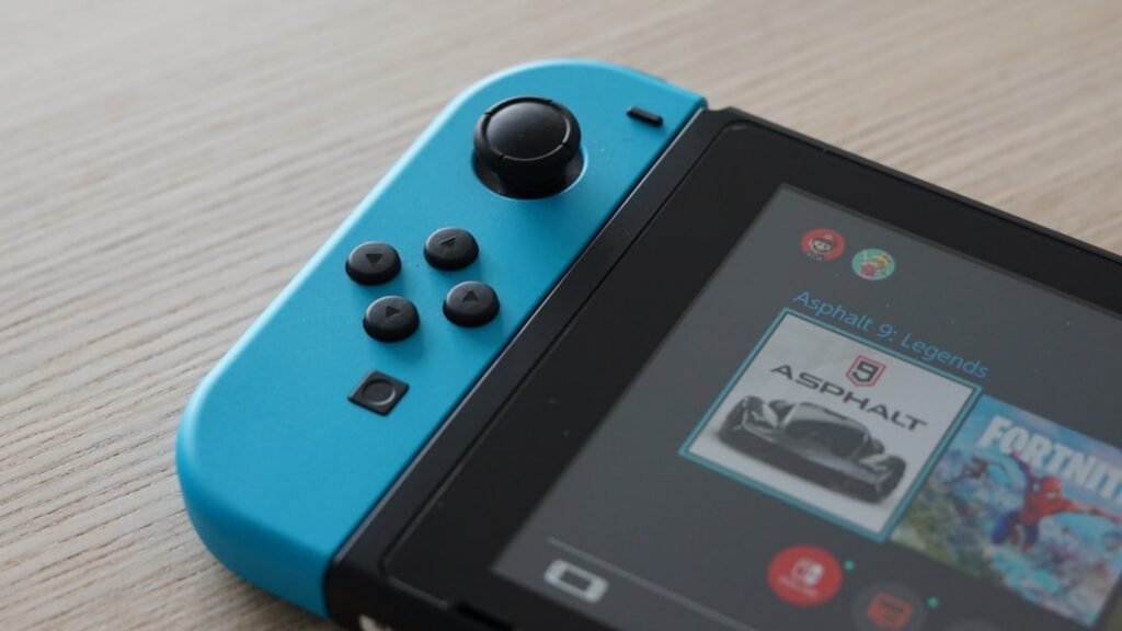 Nintendo Switch console showing game icons on screen, perfect for illustrating free Nintendo Switch games guide. Photo by Unsplash photographer.