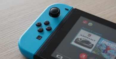 Nintendo Switch console showing game icons on screen, perfect for illustrating free Nintendo Switch games guide. Photo by Unsplash photographer.