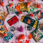 Nintendo Switch console surrounded by colorful game cartridges and autumn leaves, showcasing a diverse gaming collection. Photo by Alex Guillory.