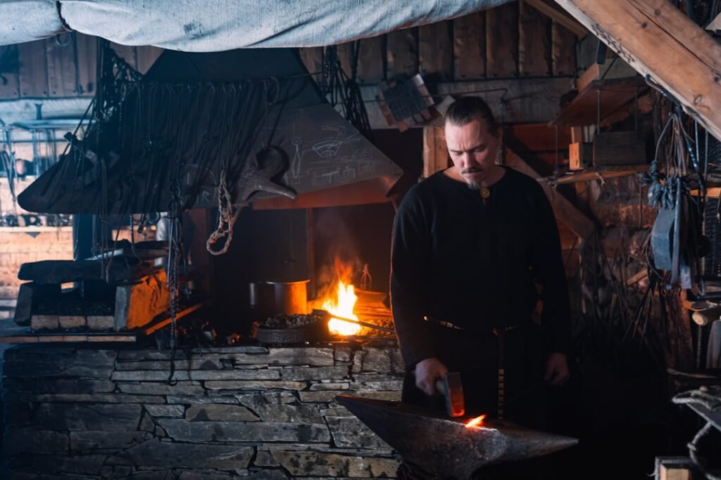 Traditional blacksmith forge and workshop representing crafting mechanics in survival games