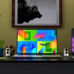 Colorful gaming setup desk with monitor displaying game library interface and RGB lighting - Photo by Alexander Andrews
