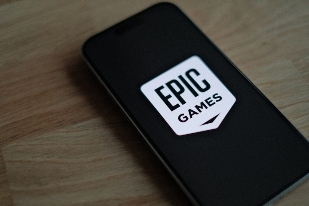 Epic Games Store logo displayed on mobile device screen showcasing the gaming platform