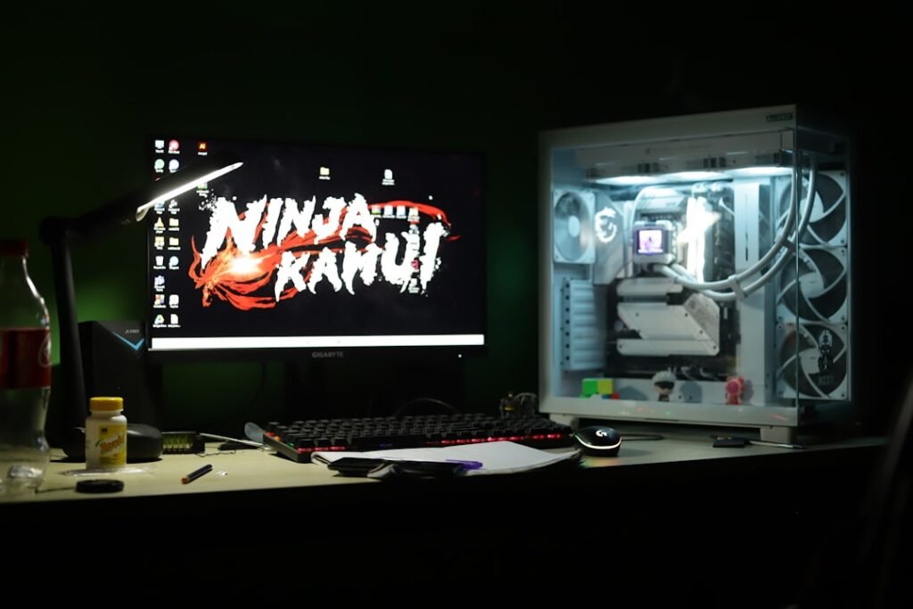Gaming computer setup with colorful monitor displaying video game interface