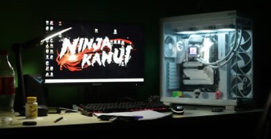 Gaming computer setup with colorful monitor displaying video game interface