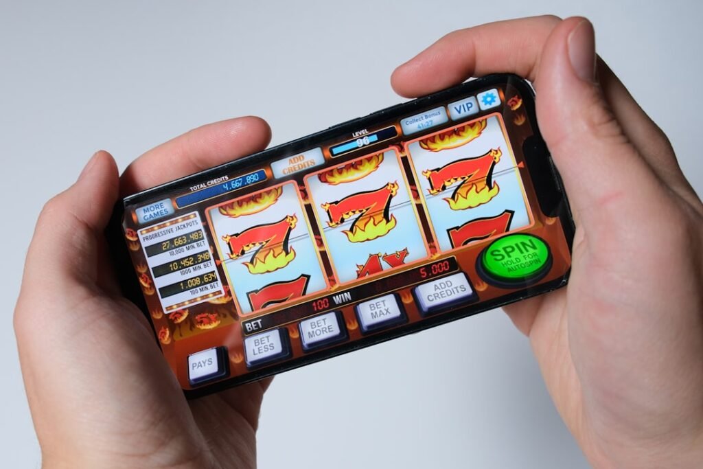 Mobile slot machine gambling game showing predatory monetization tactics to avoid in free games